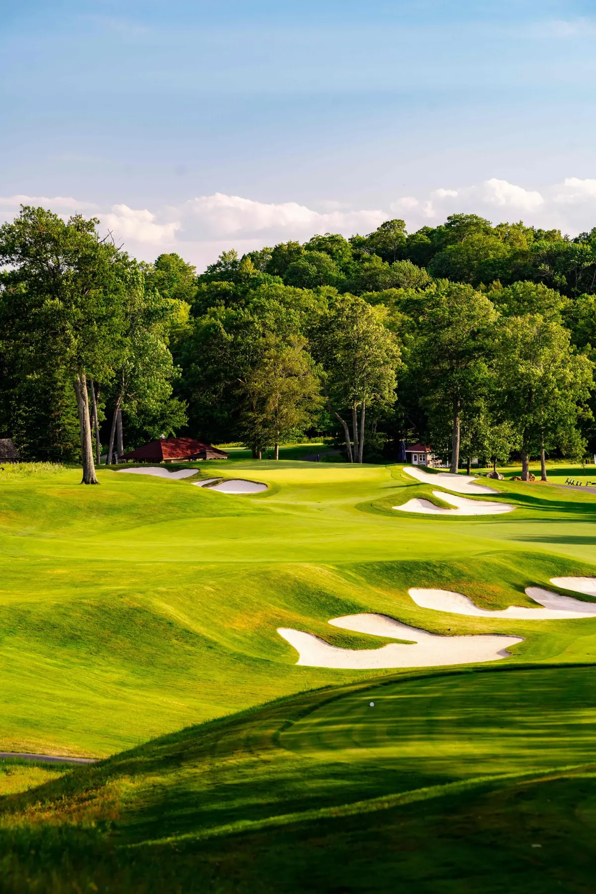 Fairway bunkers leading up to the green and clubhouse