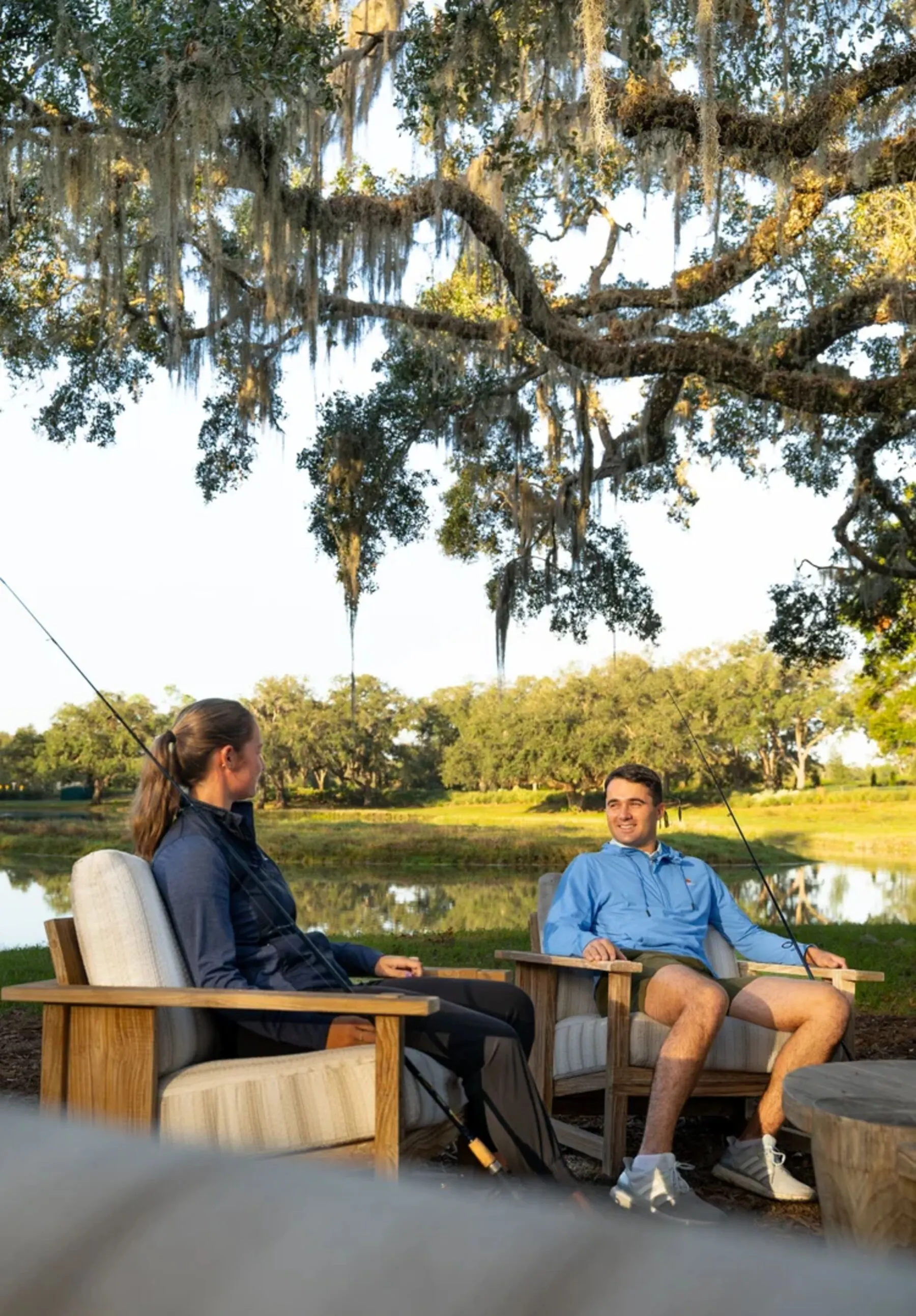 Guests fishing under an oak tree