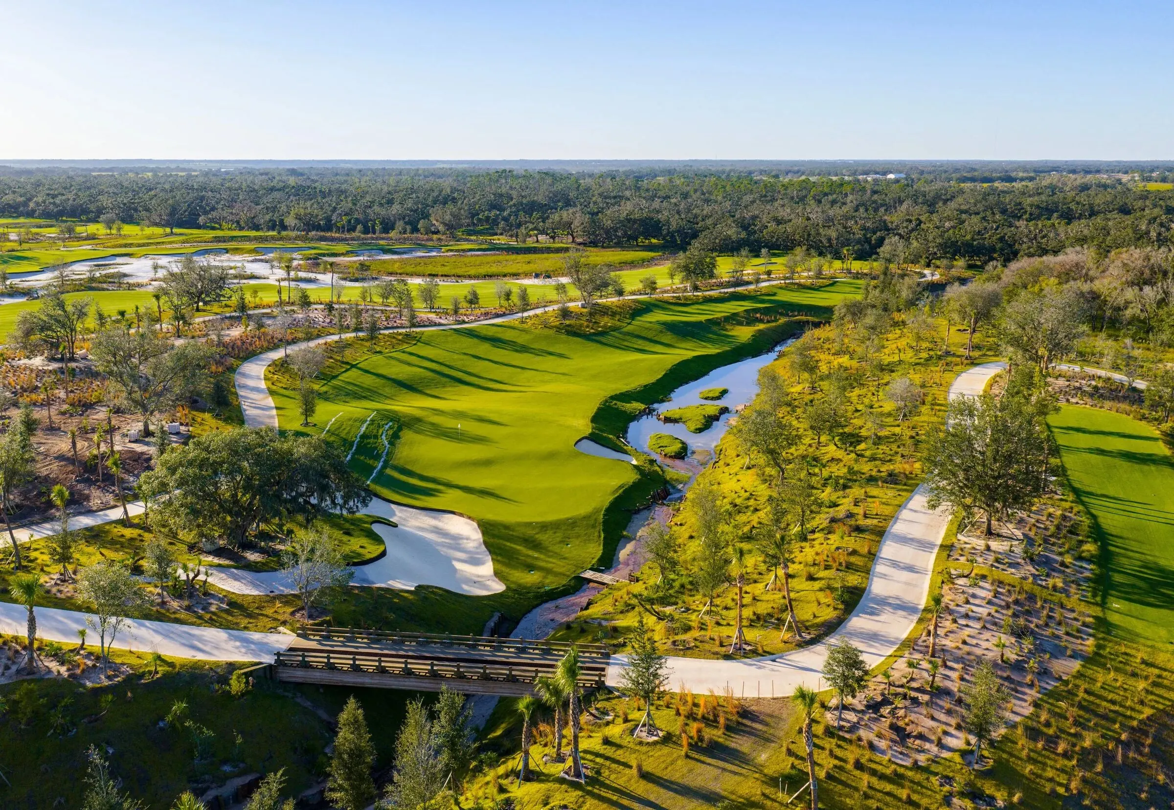 Miakka Golf Club green with water hazard and bridge