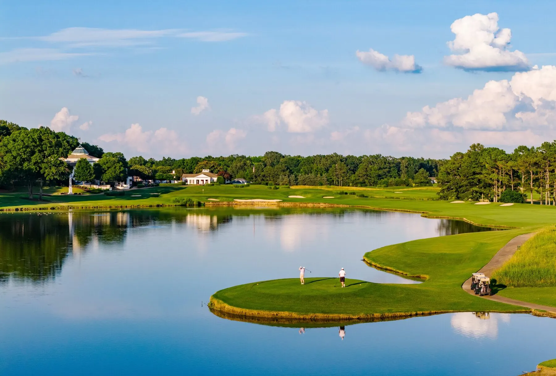 Golfers on an island green at Old Waverly